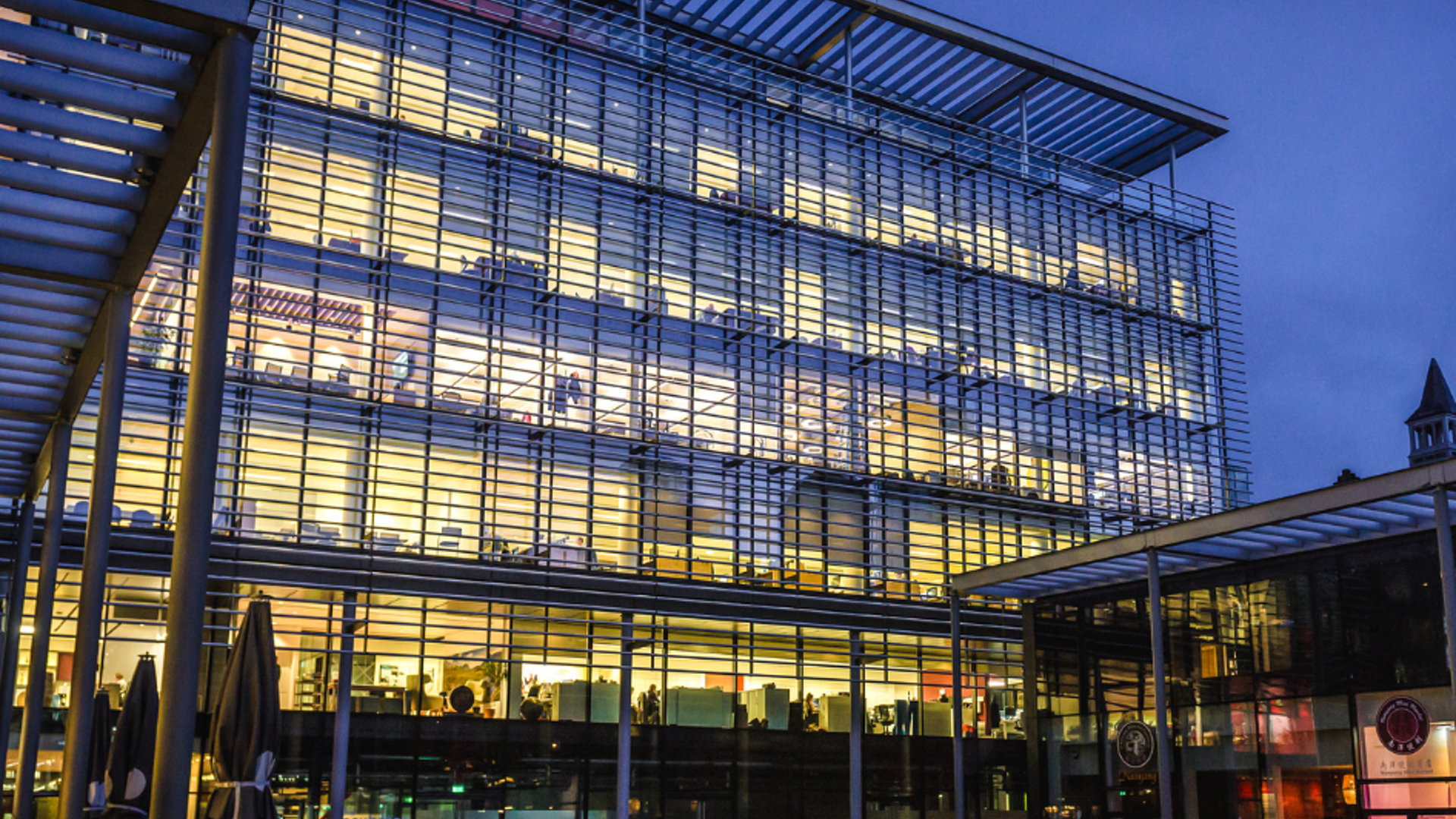 View of modern office building at dusk.